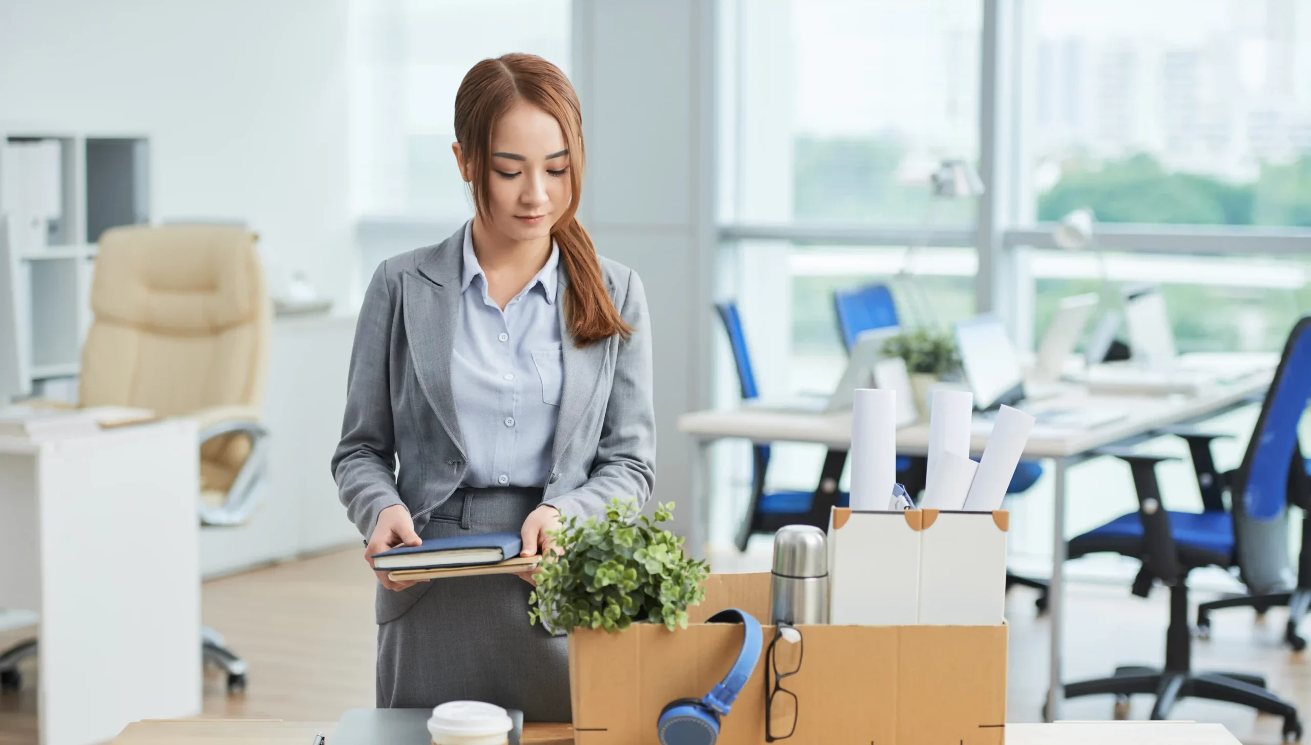 Woman standing infront of office desk